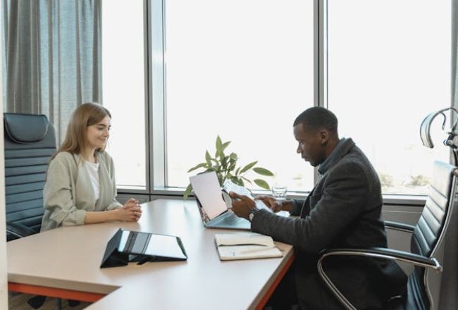 man interviewing woman