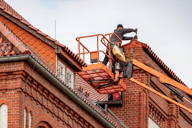 worker working on roof