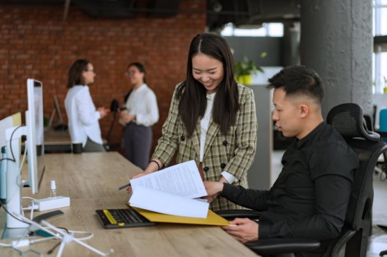 man and woman working at the office