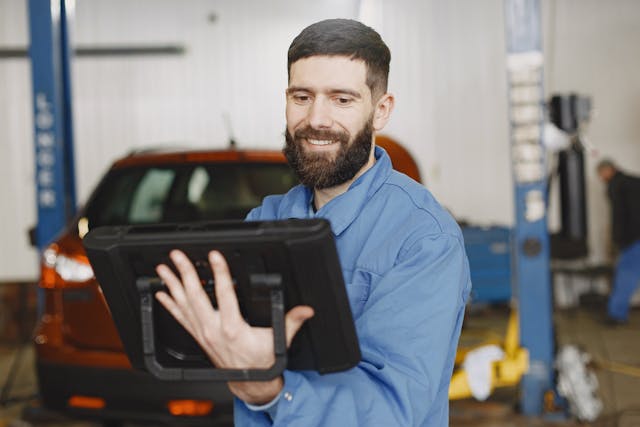 shop owner on tablet