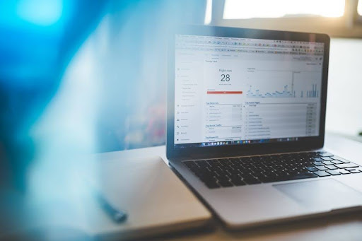 A marketer reviewing campaign analytics on a laptop