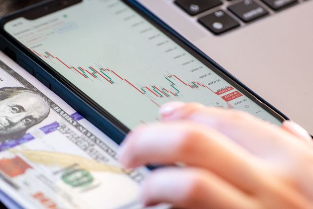 Close-up of a smartphone displaying stock market data