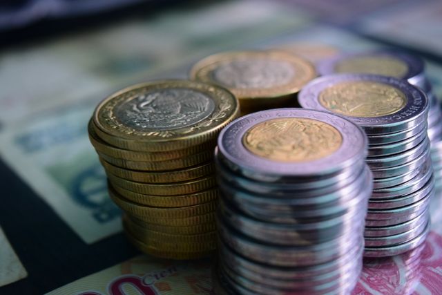 Close-up of stacked gold and silver coins