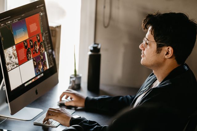 man on a computer doing graphics work