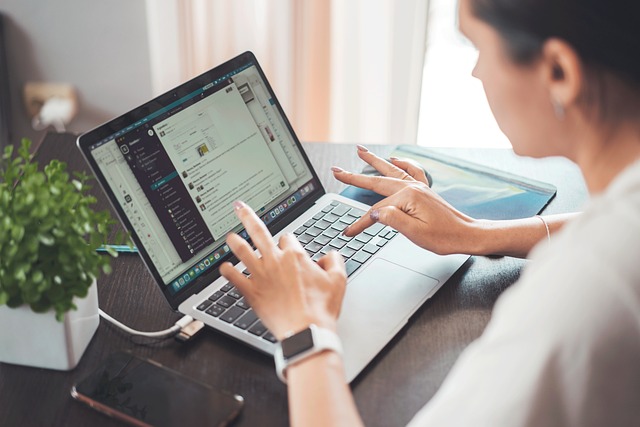 person working on advertizing on laptop