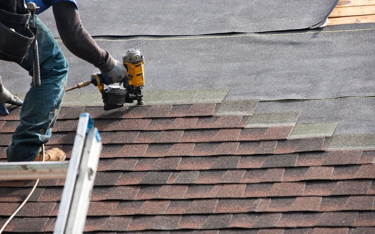 roofer installing shingles