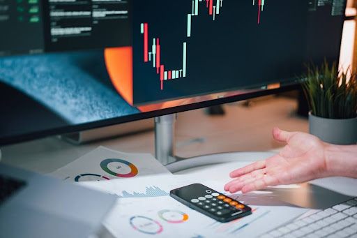 A business analyst reviewing data charts on a screen