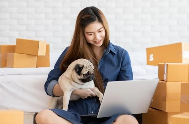 woman with dog shopping online
